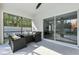 Relaxing screened-in patio with comfortable seating and views of the backyard and adjacent pool area at 724 Tahiti Dr, Kissimmee, FL 34758