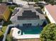 Aerial view of home with solar panels, pool, and backyard at 7801 Belvoir Dr, Orlando, FL 32835