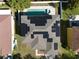 Aerial view of home featuring solar panels on the roof, and a private backyard pool at 7801 Belvoir Dr, Orlando, FL 32835