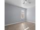 Cozy bedroom with wood-look floors, natural light and ceiling fan at 7801 Belvoir Dr, Orlando, FL 32835