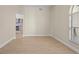Bright dining area with wood-look floors and a view into the kitchen at 7801 Belvoir Dr, Orlando, FL 32835