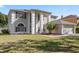 Well-maintained two-story home with a manicured lawn and an attached garage at 7801 Belvoir Dr, Orlando, FL 32835