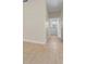 Bright hallway featuring wood-look floors and a view of the outdoors at 7801 Belvoir Dr, Orlando, FL 32835