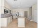 Spacious kitchen boasts stainless steel appliances, granite countertops, and an open layout with wood flooring at 7801 Belvoir Dr, Orlando, FL 32835