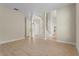 Open-concept living area featuring stairs, light floors, and neutral walls at 7801 Belvoir Dr, Orlando, FL 32835