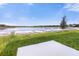 View of backyard featuring a patio and a distant pond at 4945 Worchester Dr, Kissimmee, FL 34746