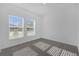 Well-lit bedroom with carpet flooring and bright windows providing natural light at 4945 Worchester Dr, Kissimmee, FL 34746