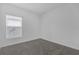 Neutral bedroom featuring a large window that provides natural light at 4945 Worchester Dr, Kissimmee, FL 34746