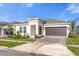 Charming single-story home with a two-car garage, nicely manicured lawn and paved driveway at 4945 Worchester Dr, Kissimmee, FL 34746