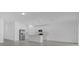 Modern kitchen with stainless steel appliances, quartz countertops, kitchen island, and white cabinets at 4945 Worchester Dr, Kissimmee, FL 34746