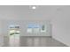 Living room featuring tile floors, ample natural light, and sliding glass doors leading to the back patio at 4945 Worchester Dr, Kissimmee, FL 34746