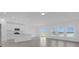 Bright open-concept living space, with tile floors, modern kitchen and dining area and a slider to a covered lanai at 4945 Worchester Dr, Kissimmee, FL 34746
