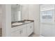 This bathroom features dual sinks, granite countertops and large mirrors at 1390 Current Pl, Haines City, FL 33844