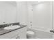 Bright bathroom features granite countertop, undermount sink, and modern fixtures at 1390 Current Pl, Haines City, FL 33844