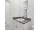 This bathroom features a granite countertop vanity and tile flooring at 1390 Current Pl, Haines City, FL 33844