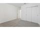 Bedroom with neutral carpet, sliding door closet, and white walls at 1390 Current Pl, Haines City, FL 33844