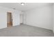 Bedroom with neutral carpet, white walls and open doorway at 1390 Current Pl, Haines City, FL 33844