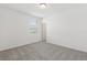 Bright bedroom with a large window and neutral carpet at 1390 Current Pl, Haines City, FL 33844