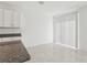 Modern kitchen with granite countertops, tile floors and a bright dining area at 1390 Current Pl, Haines City, FL 33844