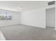 Bright, carpeted living room with natural light, freshly painted walls, and modern finishes at 1390 Current Pl, Haines City, FL 33844