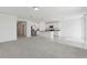 Spacious, open-concept living area flows into a modern kitchen with stainless steel appliances at 1390 Current Pl, Haines City, FL 33844