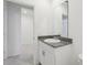 Modern bathroom with granite countertop, white cabinetry, and ample space, perfect for relaxation at 1542 Mermaid Way, Haines City, FL 33844