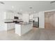 Bright open kitchen featuring an island, stainless steel appliances, and lots of cabinet space at 1542 Mermaid Way, Haines City, FL 33844
