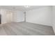 Spacious carpeted living room with a neutral color palette and ample natural light at 1542 Mermaid Way, Haines City, FL 33844