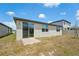 The backyard has a patio and sliding glass door, offering seamless indoor-outdoor living at 3824 Giorgio Dr, Winter Haven, FL 33884