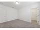 This carpeted bedroom includes baseboard trim, a ceiling light and an open closet at 3824 Giorgio Dr, Winter Haven, FL 33884