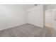 A bedroom with neutral tone carpeting, baseboard trim and a large closet at 3824 Giorgio Dr, Winter Haven, FL 33884