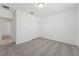 Spacious bedroom with neutral carpet, closet, and a view of an adjacent room at 3824 Giorgio Dr, Winter Haven, FL 33884