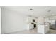 The well-lit kitchen features white cabinets, stainless steel appliances and an island at 3824 Giorgio Dr, Winter Haven, FL 33884