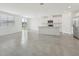 Bright, open kitchen features white cabinets, stainless steel appliances, and a large island with breakfast bar at 3824 Giorgio Dr, Winter Haven, FL 33884
