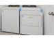 Modern laundry area features a new, white Whirlpool washer and dryer set, ready for use at 3824 Giorgio Dr, Winter Haven, FL 33884