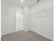 Spacious walk-in closet features built-in shelving for organized storage and leads to the bathroom at 3824 Giorgio Dr, Winter Haven, FL 33884