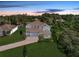 Beautiful aerial view of a gray home, nestled among lush greenery and well-manicured lawns in a quiet neighborhood at 708 Fox Edge Ct, Oviedo, FL 32765