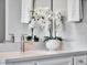 Vanity with quartz countertop and brushed gold fixtures at 708 Fox Edge Ct, Oviedo, FL 32765