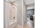 Clean bathroom with a shower/tub combo and white tile at 708 Fox Edge Ct, Oviedo, FL 32765