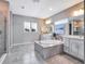 Spacious bathroom with double vanities and a large soaking tub at 708 Fox Edge Ct, Oviedo, FL 32765