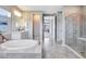Luxurious bathroom with a large soaking tub and walk-in shower at 708 Fox Edge Ct, Oviedo, FL 32765