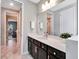 Bathroom with dark brown vanity and a quartz countertop at 708 Fox Edge Ct, Oviedo, FL 32765