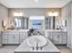 Spa-like bathroom featuring a large soaking tub and double vanities at 708 Fox Edge Ct, Oviedo, FL 32765