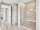 Elegant bathroom with soaking tub, walk-in shower, and double sinks at 708 Fox Edge Ct, Oviedo, FL 32765