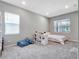Cozy bedroom with a queen-size bed and built-in shelving at 708 Fox Edge Ct, Oviedo, FL 32765