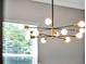 Modern chandelier with multiple light bulbs at 708 Fox Edge Ct, Oviedo, FL 32765