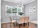 Bright dining area with glass table and seating for four at 708 Fox Edge Ct, Oviedo, FL 32765