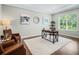 Home office with wood floors, large window, and stylish decor at 708 Fox Edge Ct, Oviedo, FL 32765