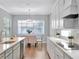 Modern kitchen with white cabinets and quartz countertops at 708 Fox Edge Ct, Oviedo, FL 32765