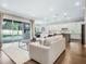 Open living space with hardwood floors and view of the pool at 708 Fox Edge Ct, Oviedo, FL 32765